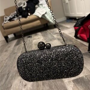 Silver and Black Crossbody Bag with Glittery Texture and Clasp Closure